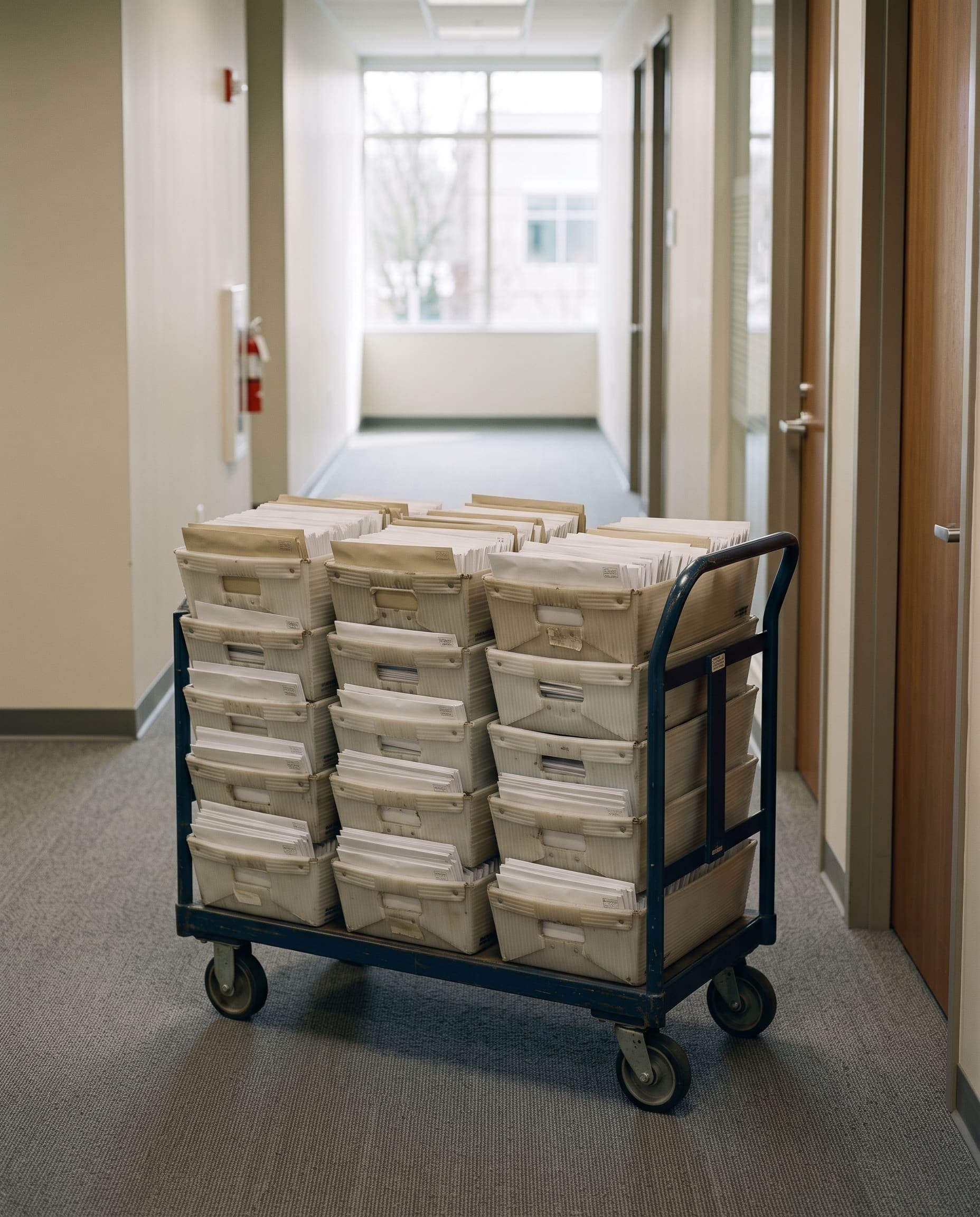 Mail cart staged for outbound metering and presort at the mailroom
